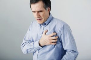 man suffering with chest pains